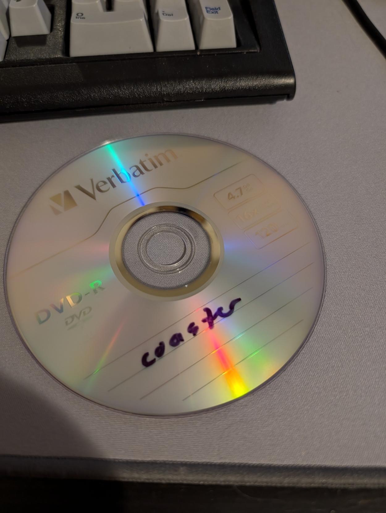 a dvd-r with the word "coaster" written on it